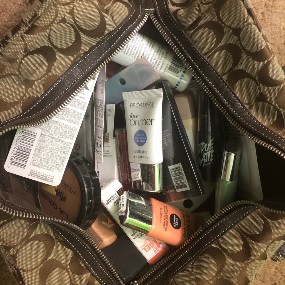 Coach purse full of makeup